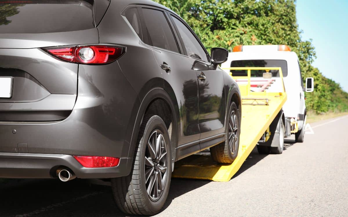 West Delray Collision Center Towing Services photo of black SUV West Delray Collision Center Towing Services photo of black SUV
