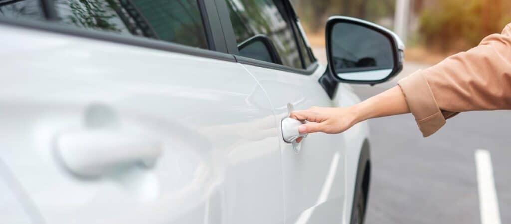 A white car after having scratches and dents repaired